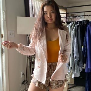 Pink blazer with gold buttons